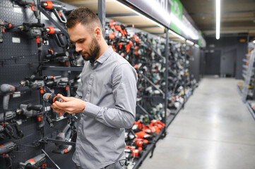 Wall Mural - male customer in a power tool store