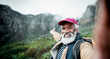 © peopleimages.com - Hiking, selfie and elderly man on mountain for fitness, hobby or wellness in retirement. Exercise, health and portrait of happy senior African person outdoor in nature for adventure or challenge