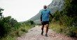 © peopleimages.com - Hip pain, senior black man and injury in nature for fitness, workout or training with accident. Runner, dead leg and elderly sports person on trail hurt with tendinitis, inflammation and arthritis