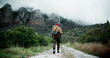 © peopleimages.com - Back, mountain or man on trail hiking in outdoor adventure or forest journey in nature for travel. Healthy, stick and person on walking for holiday, exercise or trekking to explore for wellness