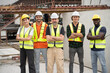© chachamp - Portrait mature Caucasian engineer man with Multi-ethnic Team engineer or team labor at precast cement outdoor factory