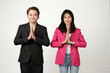 © Ibenk.88 - Portrait of successful Asian business man and business woman with greeting hand gesture on isolated background