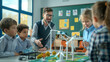 © BB_Stock - Wind turbine model in a primary school classroom Teacher explains how wind turbines and solar cells work. Sustainable and environmentally friendly renewable energy