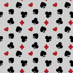 Pattern of playing card suits in modern style on gray background. Abstract vector illustration graphic design.