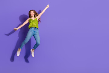 Wall Mural - Full size photo of pretty teenager girl hang empty space wear trendy green outfit isolated on purple color background