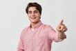 © Igor - Smiling young man pointing at something isolated on white color background