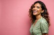 © mamo studios - Side view of an attractive hispanic woman feeling happy in front of a bright pink background,generative ai