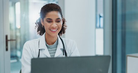 Poster - Happy woman, doctor and typing with laptop for healthcare, good news or telehealth at hospital. Female person or medical employee with smile on computer for online research or communication at clinic