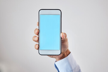 Wall Mural - technology, hand and phone with mockup on green screen for social media advertising space or company