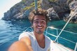 © Igor - Young Man Taking a Selfie on a Boat in a Sunny Coastal Landscape