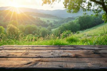 Wall Mural - a wooden table top with a blurred summer background, a meadow with green grass and sunlight. The design of the presentation emplate.