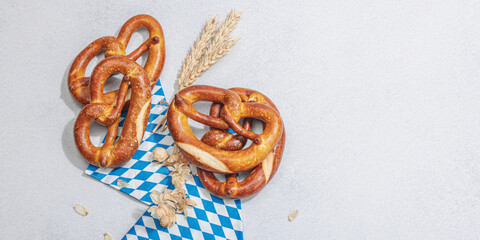 Wall Mural - Traditional Oktoberfest Pretzels. German festival food concept. Trendy hard light, dark shadow