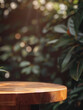 © sorninai - Wooden podium against a background of dark green tropical leaves. Tropical forest. Pedestal, stand. Eco-friendly, natural design. Wooden table. Mockup, empty space for advertising. Evening light.