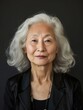 © VISUAL BACKGROUND - A woman with white hair and a black jacket