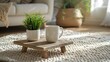 © horizon - Minimalist living room, wooden coffee table with angled legs, white ceramic mug, white plant pot with small green plant, white textured carpet with geometric pattern.