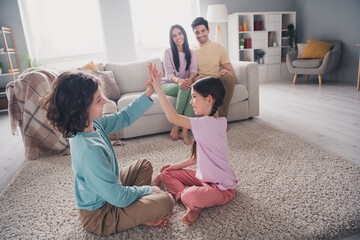 Sticker - Photo of beautiful cute children dad mom dressed casual clothes spending time together indoors house apartment room