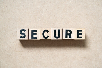 Wall Mural - Alphabet letter block in word secure on wood background