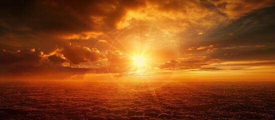 Poster - Scenic countryside landscape at sunset or sunrise with a bright dramatic sky above a dark ground featuring a sun over the skyline and horizon perfect for copy space images