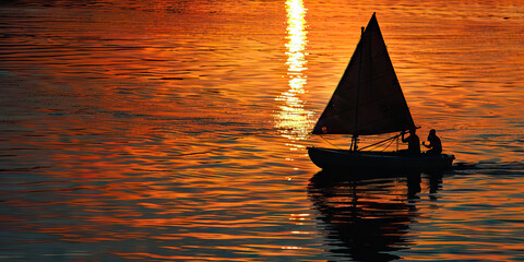 Wall Mural - Serene Sunset Sail: A small wooden boat gently rocking on the water, with people relaxing and enjoying the view.