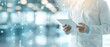 © nattapon98 - A healthcare professional in a lab coat uses a digital tablet in a modern medical environment, symbolizing innovation and technology.