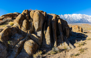 Wall Mural - Eroded Granite Wall and The Snow Capped Sierra Nevada Mountains, Alabama Hills National Scenic Area, California, USA