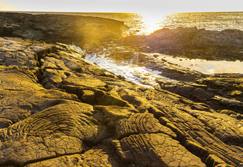 Wall Mural - Sunset Over The Lava Sinks and Volcanic Cliffs at Hokulia Shoreline Park, Hawaii Island, Hawaii, USA