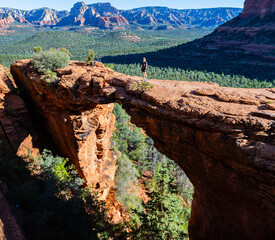 Wall Mural - Female Hiker on Devils Bridge and The Secret Mountain Wilderness, Coconino National Forest, Sedona, Arizona, USA