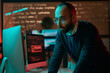 © Mediaphotos - Portrait of bearded adult man wearing glasses and using computer preventing emergency in cybersecurity department copy space
