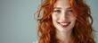 © Ilgun - A confident and stylish red haired woman portrays a sense of pride coolness cheekiness and success while smiling in an image with copy space