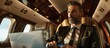 © Ilgun - A businessman with a credit card in hand gazes at the camera near a laptop inside a private jet against a backdrop of a luxurious interior with ample copy space image