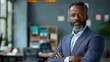 © Johannes - businessman corporate portrait in office, mature black middle aged manager business man