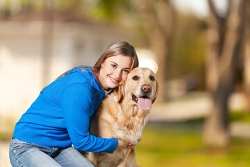 Poster - A young beautiful girl with dog for a walk.