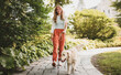 © Louis-Paul Photo - Portrait of teenage girl having fun outside with golden retriever