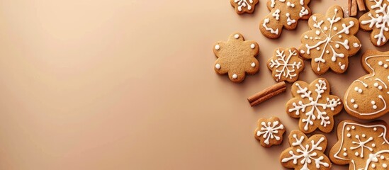 Poster - Gingerbread cookies on a beige backdrop with copy space image