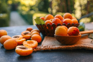 Wall Mural - Wooden spoon with apricots, concept of harvest and summer preserves