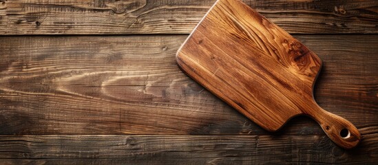 Poster - Copy space image featuring a wooden cutting board on a wooden surface