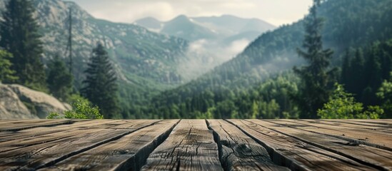 Poster - Wooden table top with mountain and forest background provides ample copy space for product placement against a scenic backdrop