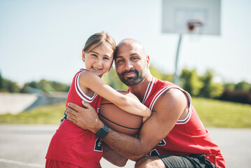 Wall Mural - Basketball, sport with a dad and daughter training on a court outside for leisure fitness and fun