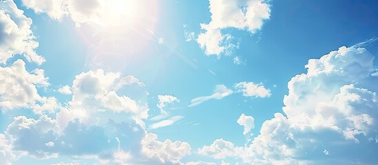 Canvas Print - Sunny summer day with fluffy white clouds against a blue sky creating an empty background perfect for a copy space image