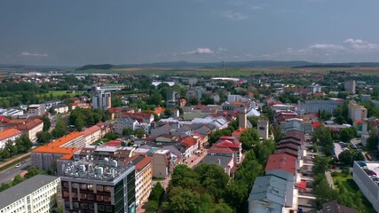 Wall Mural - Summer skyline cityscape of Poprad (Spiš, northern Slovakia, near High Tatra Mountains) famous for its historic centre and as a holiday resort. Aerial panoramic view of Námestie svätého Egídia sqaure.