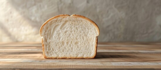 Poster - Fresh white bread slice on a wooden table background with copy space image Vegan product