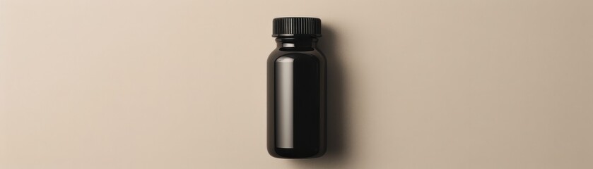 Wall Mural - A black bottle with a white label sits on a table