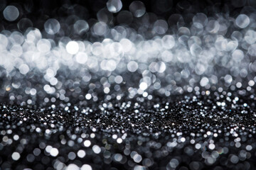 black and white photo of silver glitter on a black background