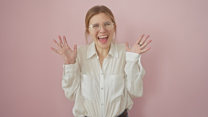 Poster - Excited young blonde woman in glasses laughing against a pink background