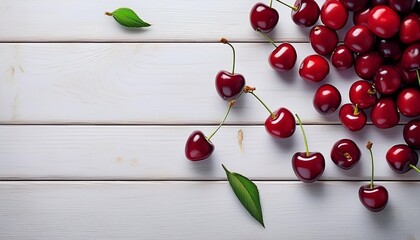 cherries on white wooden table seen from above