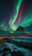 Wall Mural - Aurora borealis illuminating Kirkjufell mountain landscape