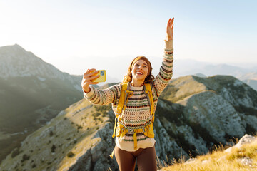 Selfie, woman on video call and mountain travel holiday.  Nature freedom adventure, happy vacation. Blogging.