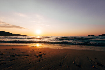 Wall Mural - a sunset on the sea beach