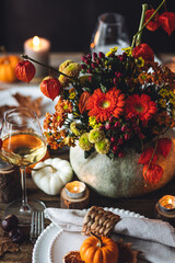 Wall Mural - Beautiful seasonal decorated Thanksgiving table for cozy family dinner or fall luxury countryside wedding. Elegant beautiful setting for holiday event, party, reception. Wineglasses and fancy dishes.