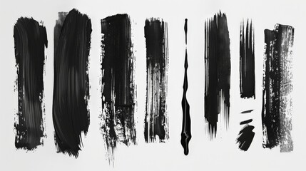 Fototapete - A variety of black paint strokes applied on a plain white background, presenting different textures and thicknesses for creative and modern art projects.